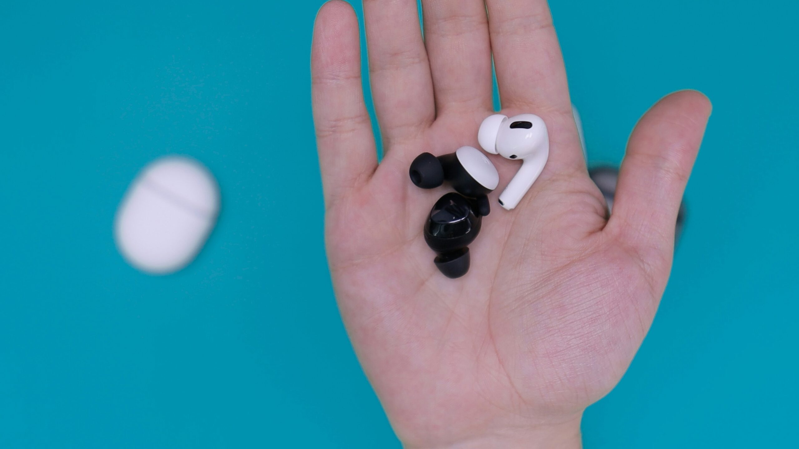 white and black earbuds